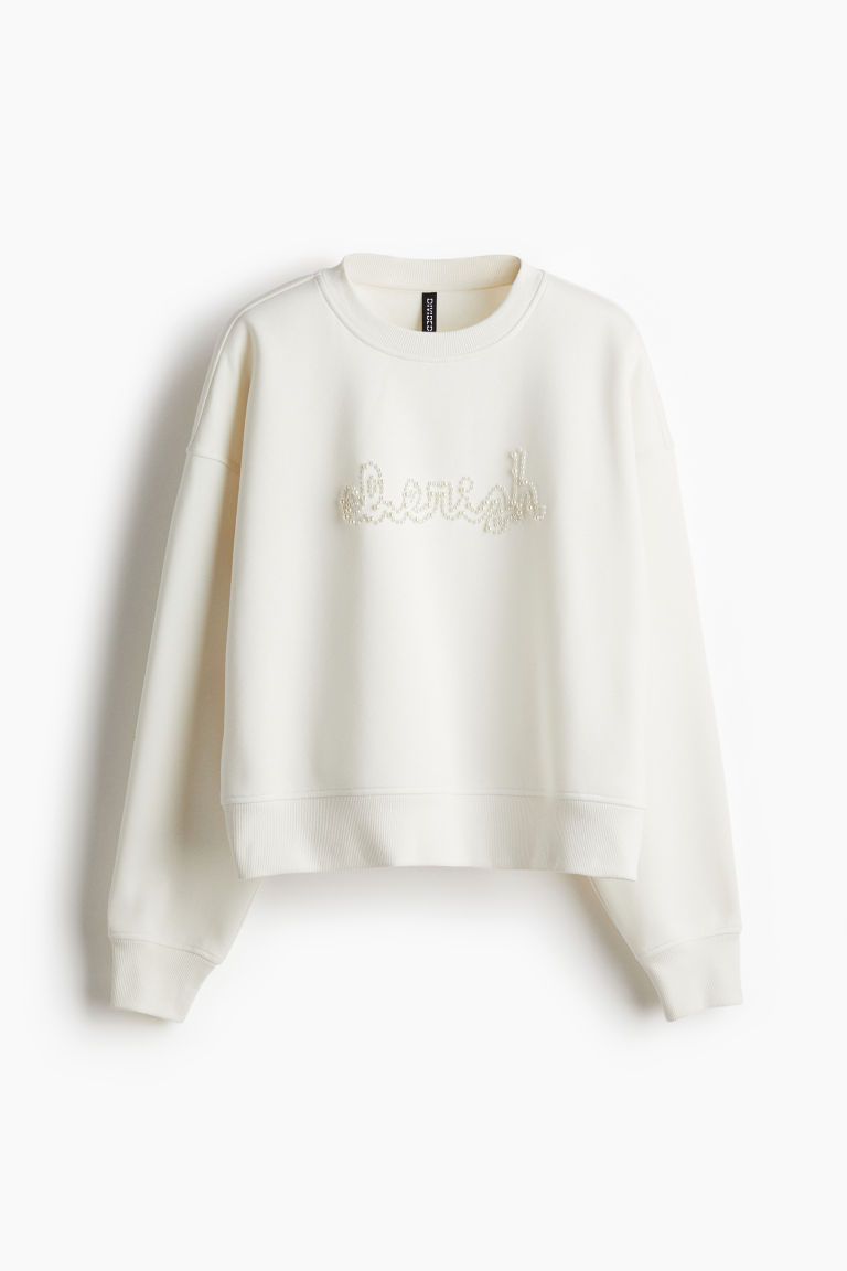 H & M - Oversized sweater met decoraties - Wit