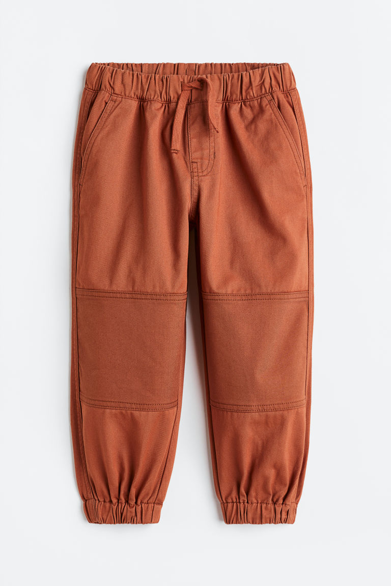 H & M - Joggers van katoenen twill - Loose Fit - Oranje