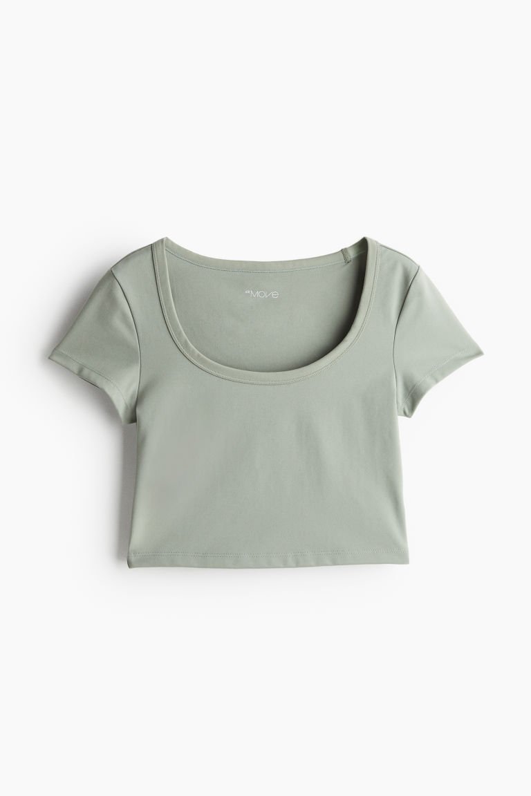 H & M - Cropped sporttop van DryMove™ - Groen