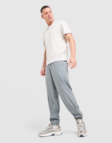 Nike Dri-FIT toelopende multifunctionele herenbroek Form - Grijs- Heren